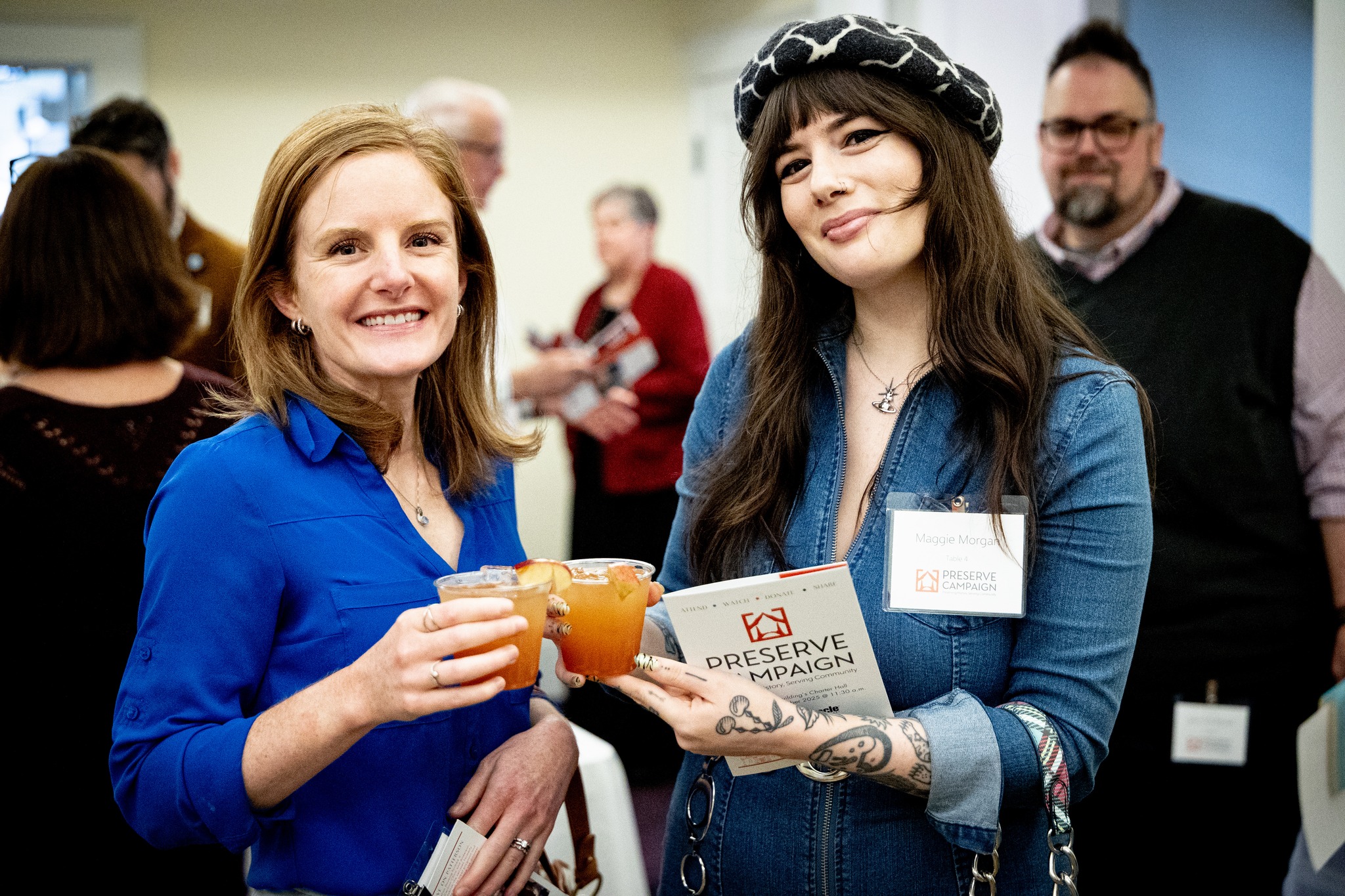 two girls holding drinks